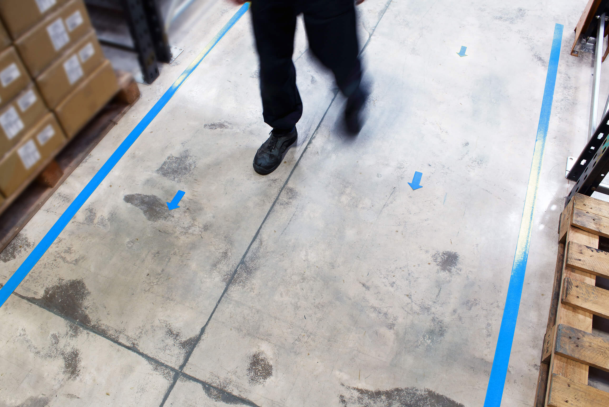 Blue PermaStripe Line Marking Tape Applied as Warehouse Walkway Blue PermaStripe Line Marking Tape Applied as Warehouse Walkway
